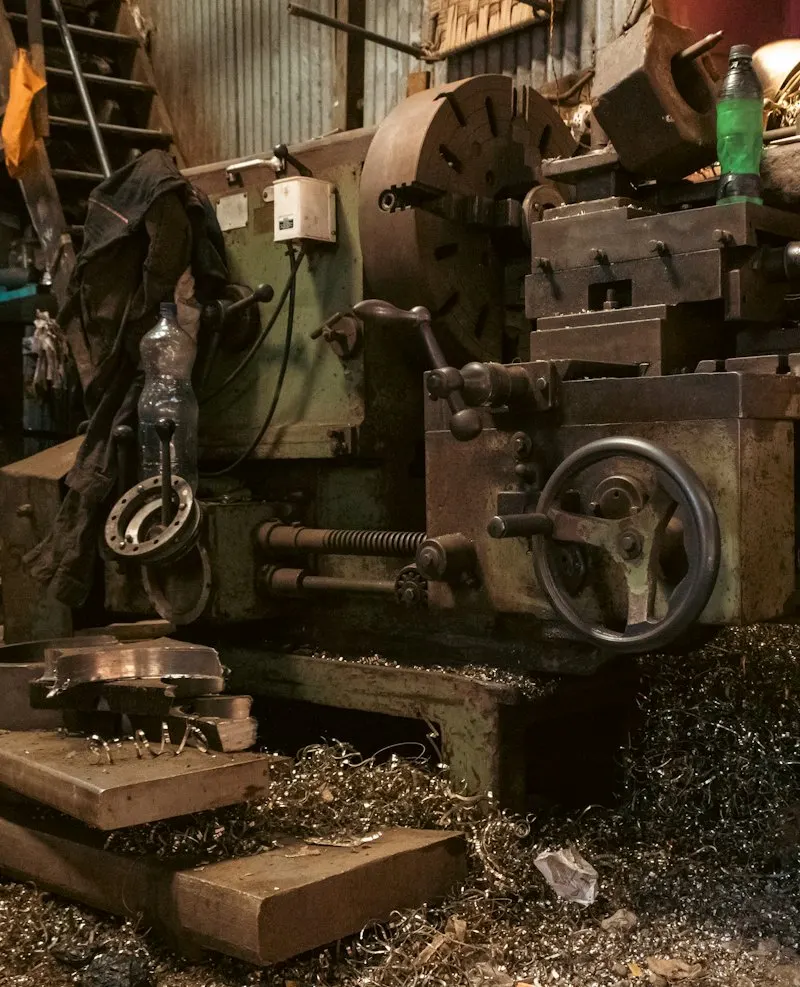 Metal lathe covered in shavings